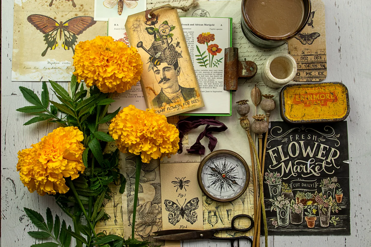 Flowers, botanical prints and gardening books on a desk