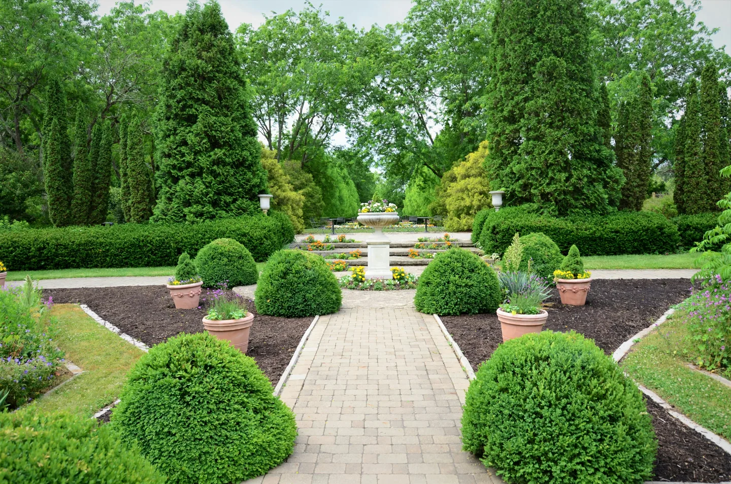 Structured garden with clipped hedges and gravel paths